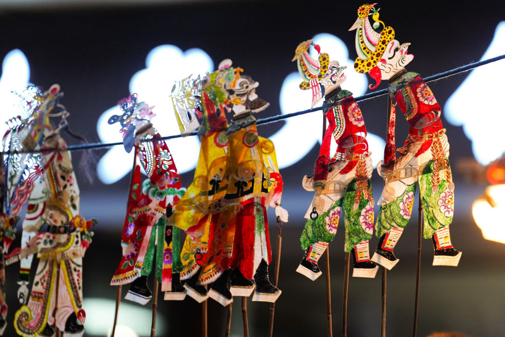 图片故事丨老周的皮影进城记